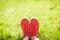 Feet in sneakers in green grass