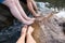 Feet Soaking with water streams relaxing in nature or nature spa concept
