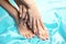 Feet spa, legs foot massage in spa. Woman feet care. Legs stockings, tights Beautiful manicured feet with a neat pedicure