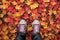 Feet stand in Autumn woods with beautiful Fall foliage colors. Autumn seasonal concept.