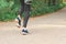 Feet step runner on the road, closeup shoes. Start running on the sidelines. Run outdoor exercise activity concept.