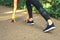 Feet step runner on the road, closeup shoes. Start running on the sidelines. Run outdoor exercise activity concept.