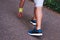 Feet step runner on the road, closeup shoes. Start running on the sidelines. Young handsome man jogging along scenic path in park.