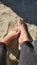 Feet sunbathing at the beach