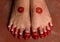 Feet of a teen girl painted with red color