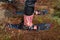 Feet of a tourist in marshes against the background of marsh vegetation