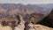 Feet Of A Tourist In Trekking Boots Resting On The Top Of The Grand Canyon