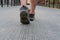 feet of traveler man walking on footbridge. tourist crossing through bridge. travel lifestyle, summer vacation concept