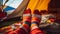 Feet wearing striped woollen socks in a tent