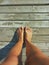 Feet on a wooden catwalk