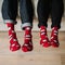 Feet in woollen socks. Pair relaxing with a cup of hot drink and warming up their feet in woollen socks.