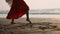 Feet of young girl with angel wings dancing at sunset