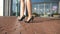 Feet of young woman in high-heeled footwear going in the city. Female legs in high heels shoes walking in the urban