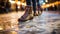 feet of a young woman skating on ice rink at night in winter