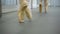 The feets of two ballerinas in pointe, who does pas de bourree turning right in studio.