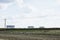 Feild with three water tanks in Texas