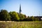 Feldmochinger church tower with bee meadow, bee pasture, bee field