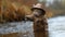 Felidae carnivore cat in raincoat and hat fishing in river