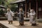 Feline Tai Chi Masters: Three Cats in Human Tunics Practicing in a Courtyard.