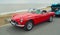 FELIXSTOWE, SUFFOLK, ENGLAND - MAY 07, 2017: Classic Red Triumph Spitfire Convertible Motor Car Parked on Seafront Promenade.