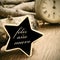 feliz ano nuevo, happy new year in spanish, in a star-shaped chalkboard, in sepia tone