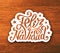 Feliz navidad hand lettering sticker on wood