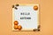 Felt boar with text Hello autumn, pumpkin on orange color background Top view Flat lay Seasonal concept Hello September, October,