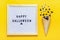 Felt board with text, quote, black spiders and flies, googly eyes crawl out of ice cream cone on yellow background