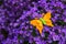 Felt butterfly atop a violette lilac bush