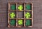 Felt four-leaf clover in the wooden box on sackcloth and cell copy space. Lucky shamrock, St.Patrick`s day holiday symbol