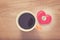 felt heart with Made With Love button and cup of coffee on wooded table