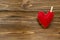 Felt heart on ribbon on wooden background