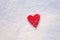 Felt heart on snow, Valentine`s day