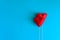Felt love hearts on booth props on blue paper background. Valentine`s day celebration concept.