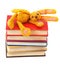 Felt soft toy rabbit lies on stack of books