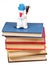 Felt soft toy snowman on stack of books