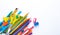 Felt-tip pens and pencils on a white background. Stationery layout. School theme. Preparing for school .Color school supplies