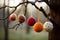 felted ornaments hanging from the tree and creating a warm atmosphere