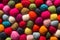 Felting background: top view of multicolored woolen balls