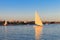 Felucca boats sailing on Nile river in Luxor, Egypt. Traditional Egyptian sailing boats