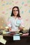 Female accountant in glasses sitting at workplace