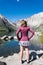 Female adult stands by Convict Lake in the springtime, located off of US-395, near Mammoth Lakes California in the eastern Sierra