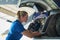 Female Aero Engineer Working On Helicopter In Hangar