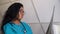 Female african-american doctor examines x-ray of lungs in clinic. Doctor examines x-ray of lungs of a patient with