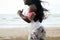 Female african runner jogging during outdoor workout on beach