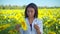 Female agronomist controlling quality of sunflowers