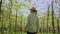 Female agronomist inspecting spoiled bad harvest on vegetable farm. Caucasian woman farmer walks in dried leaves orchard