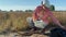 Female agronomy scientist preparing for soil measurements outdoors