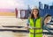 Female Airport Aircraft engineer Mechanic with airport passenger bridge on the background