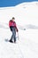 Female alpinist standing on glacier.